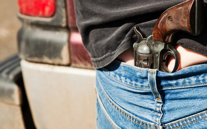 Understanding the Pros and Cons of Small Of Back Carry for Handguns